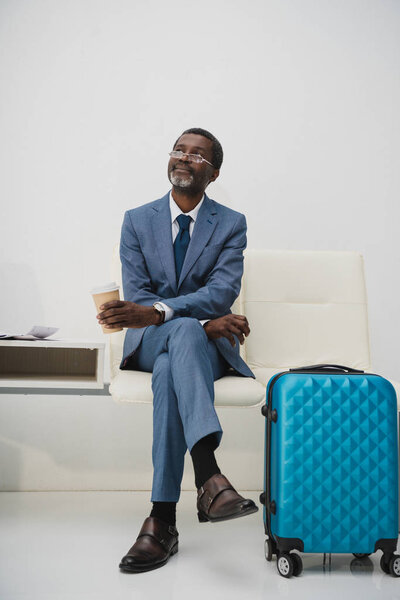 businessman holding coffee