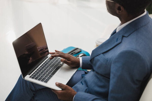 man working with laptop