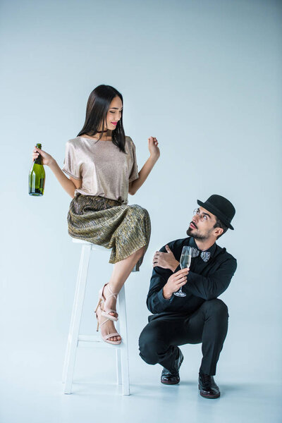 multiethnic couple with champagne