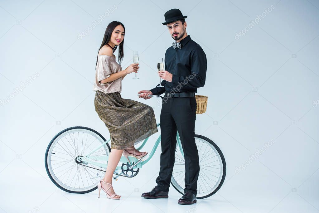 fashionable multicultural couple with champagne