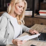 Woman using laptop at home