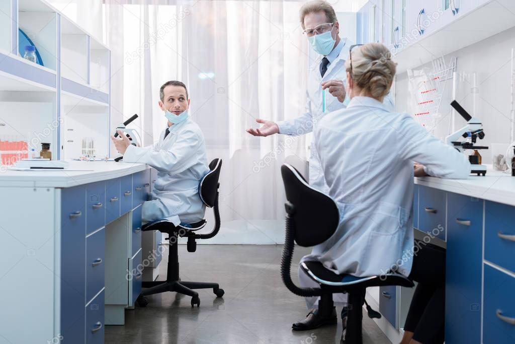 Medical workers talking in laboratory