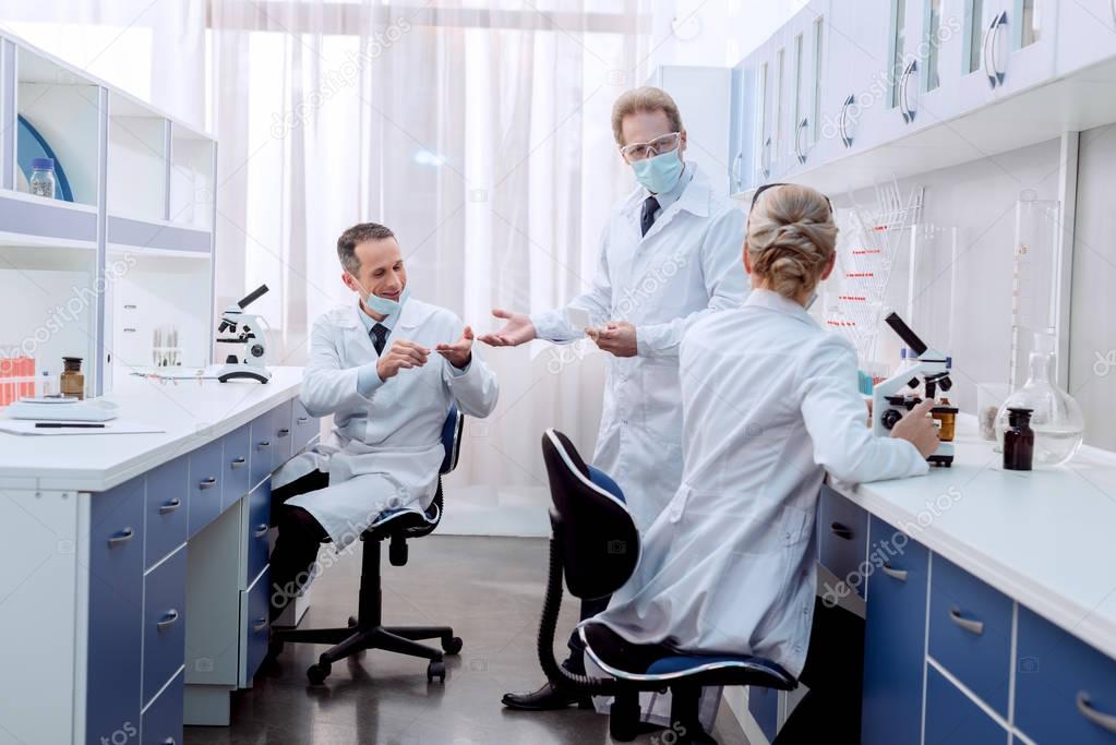 Medical workers talking in laboratory