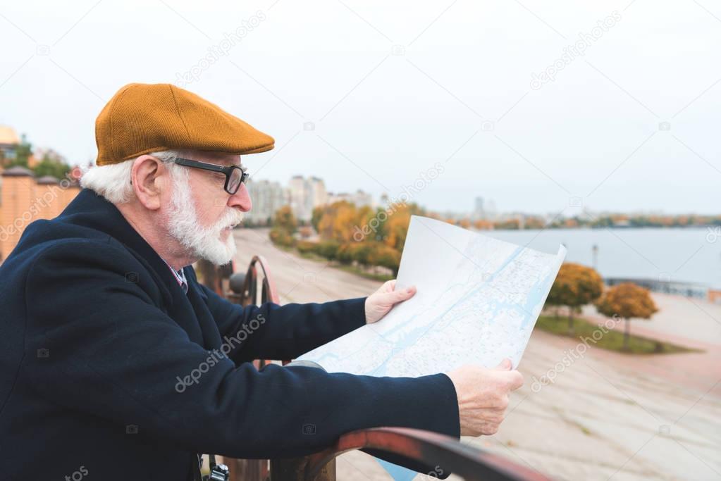 man looking at map 