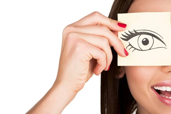 Woman covering eye with sticker — Stock Photo, Image