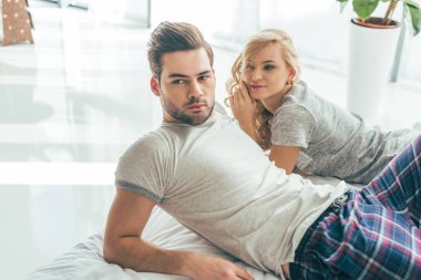 young couple in bedroom clipart