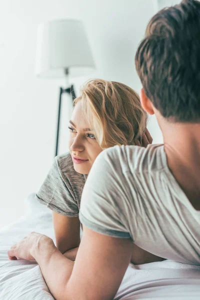 Young couple in bedroom — Stock Photo, Image