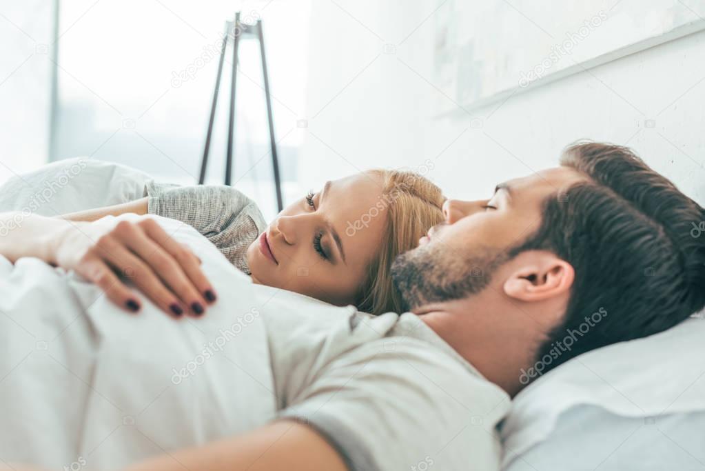 young couple in bed