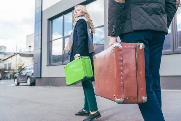 Young couple with suitcases — Free Stock Photo