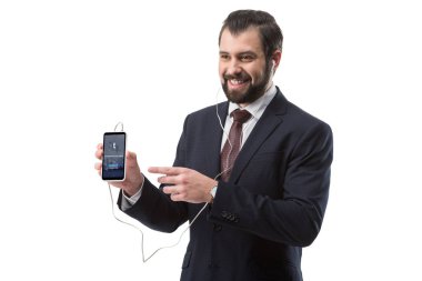 Smartphone vasıl işaret eden işadamı