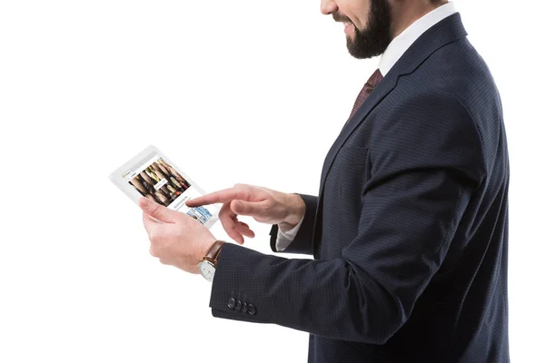 Businessman with tablet with depositphotos website — Stock Photo, Image