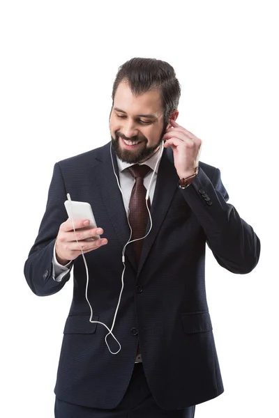 Businessman listening music — Free Stock Photo