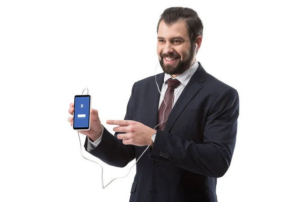 Businessman pointing at smartphone — Stock Photo, Image