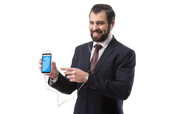 Hombre de negocios apuntando al teléfono inteligente —  Fotos de Stock