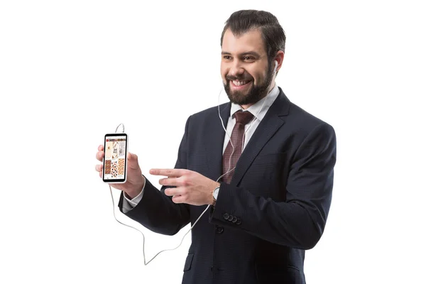 Businessman pointing at smartphone — Stock Photo, Image