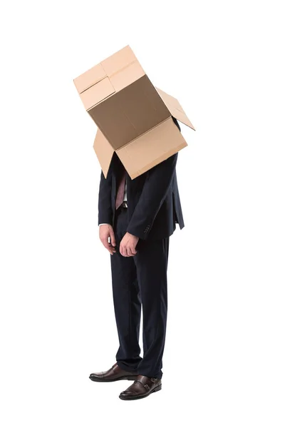 Tired businessman with box on head — Free Stock Photo
