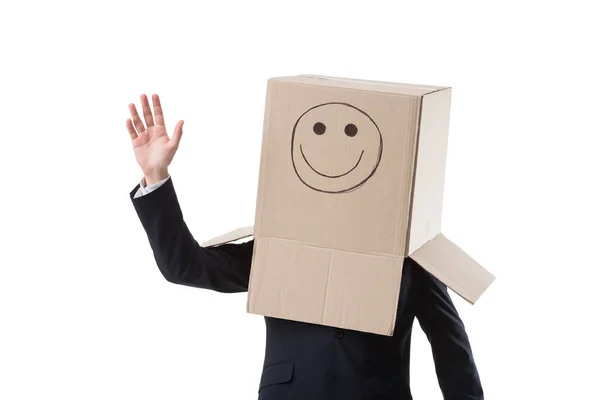Waving businessman with box on head — Stock Photo, Image