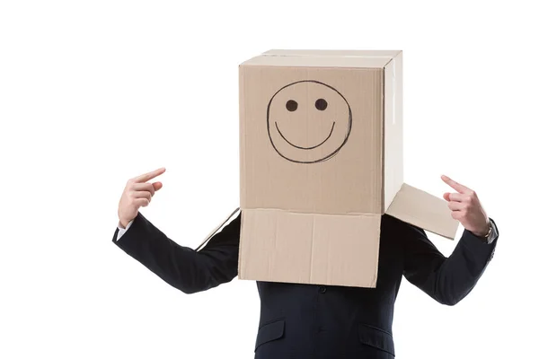 Businessman pointing on box on his head — Free Stock Photo