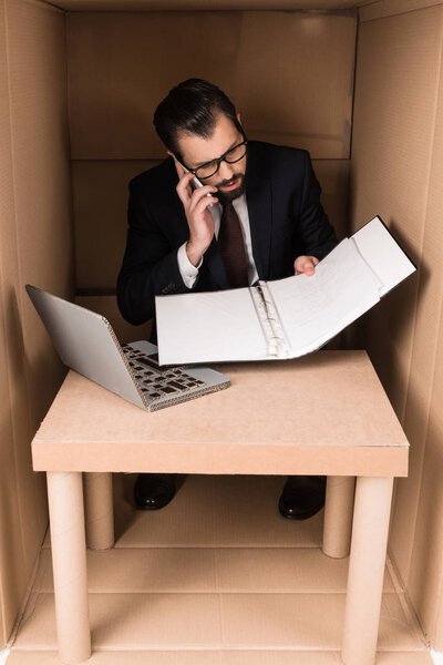 businessman working with documents and smartphone