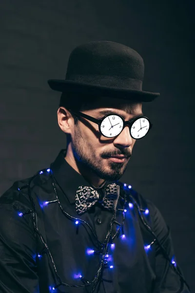 Fashionable man with christmas lights — Stock Photo, Image