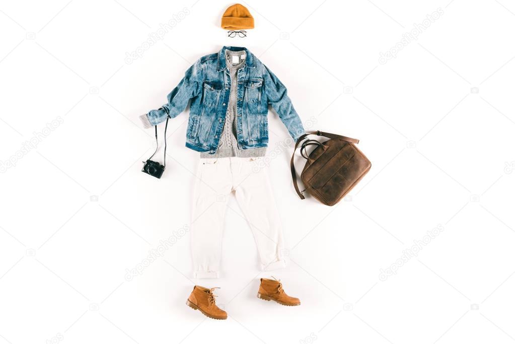 fashionable clothes with camera and bag