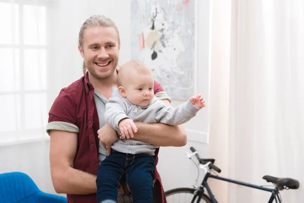 Happy Dad Holding Baby Boy Hands Home — Stock Photo, Image