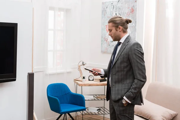 Handsome Businessman Standing Holding Remote Controller Home — Stock Photo, Image