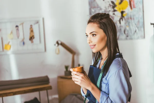 Beautiful Seamstress Standing Holding Cup Tea — Free Stock Photo