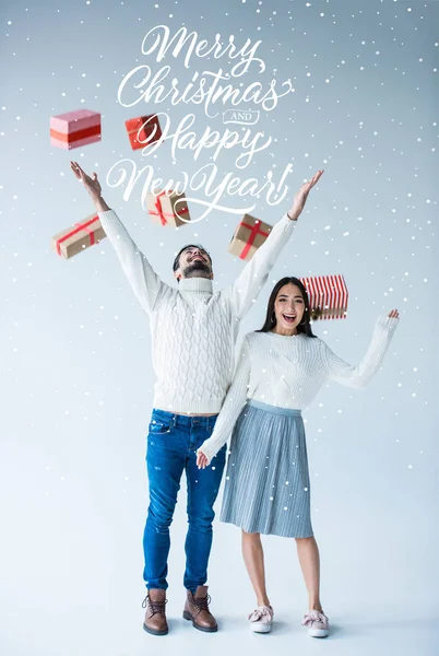 Multicultural couple with wrapped christmas presents — Stock Photo, Image