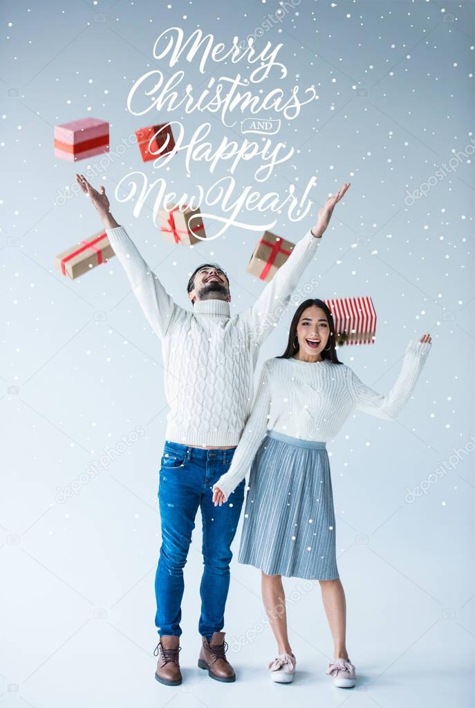 multicultural couple with wrapped christmas presents