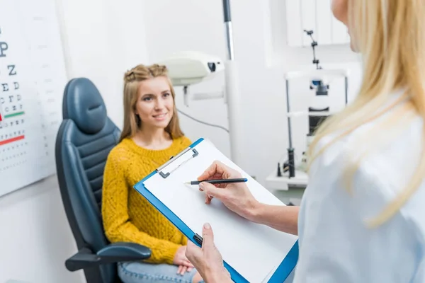 Cropped View Oculist Writing Diagnosis Patient Clinic — Stock Photo, Image