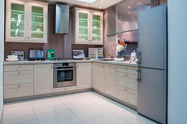 modern kitchen interior with grey refrigerator