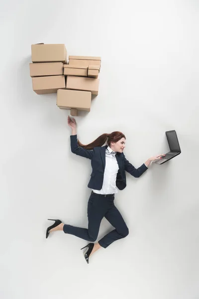 Overhead View Businesswoman Cardboard Boxes Using Laptop Isolated Grey — Stock Photo, Image