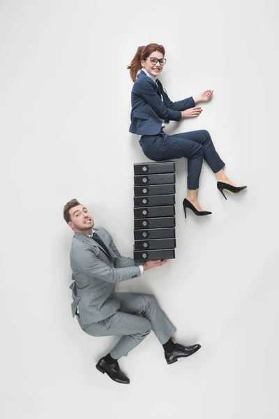 Overhead View Businessman Holding Smiling Businesswoman Pile Folders Isolated Grey — Stock Photo, Image