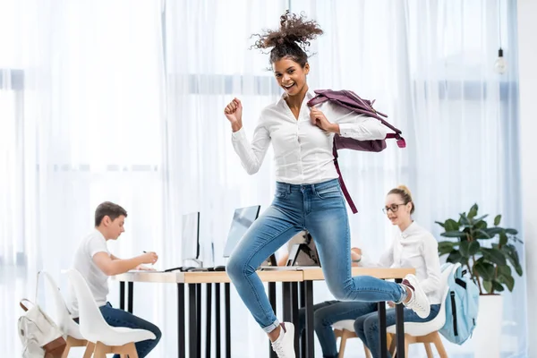 Young African American Student Girl Jumping Classroom Friends — Stock Photo, Image