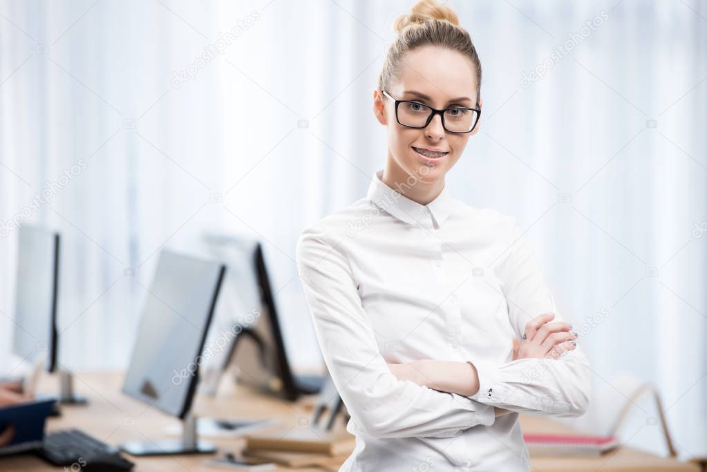 young caucasian student girl in empty classroom