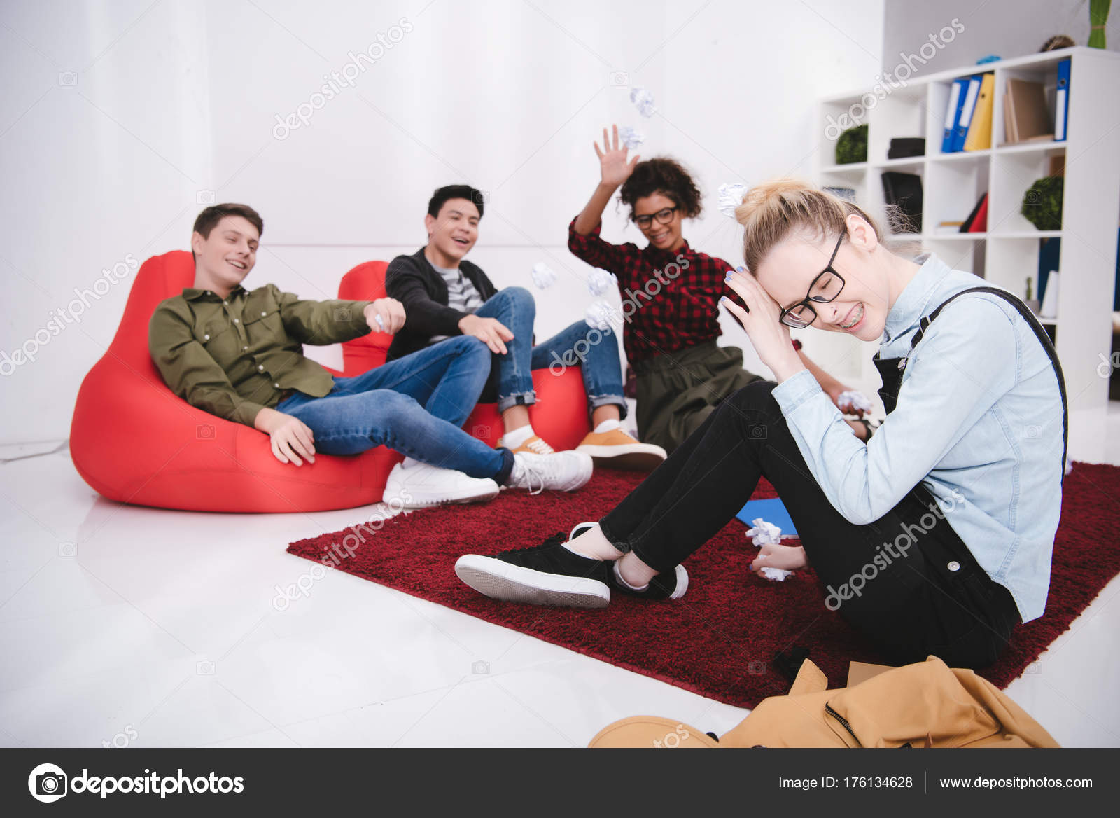 Young Students Sitting Armchairs Throwing Paper Classmate — Stock Photo