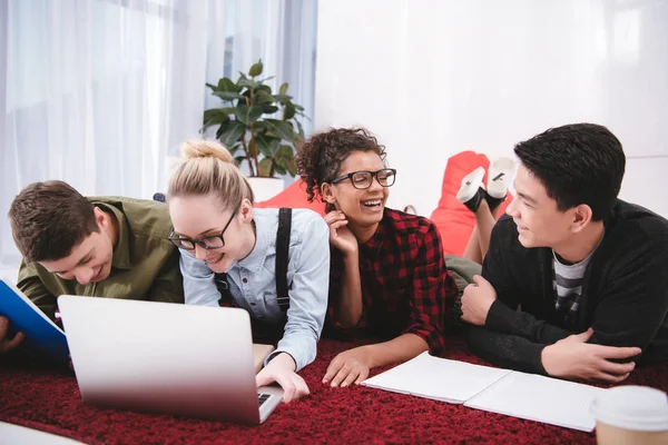 Young Teen Students Lying Carpet Notebooks Looking Laptop — Stock Photo, Image