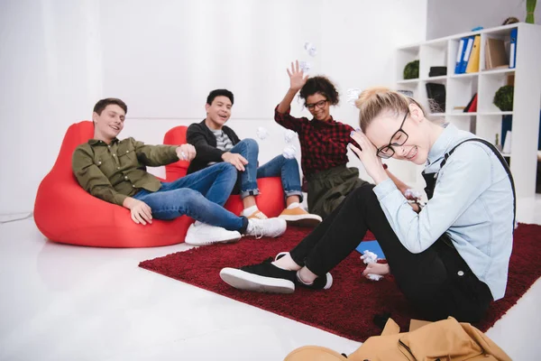 Young Students Sitting Armchairs Throwing Paper Classmate — Stock Photo, Image