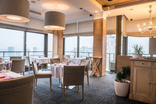 served tables for visitors in cozy restaurant