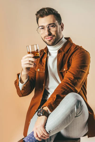 Portrait Smiling Stylish Man Glass Cognac Isolated Beige — Free Stock Photo