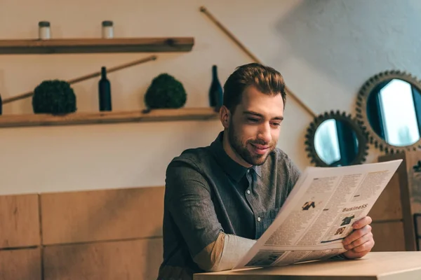 Portrait Smiling Businessman Reading Newspaper Table Cafe — Stock Photo, Image