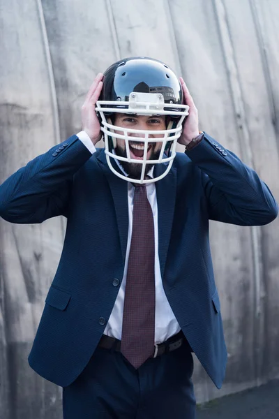 Portrait Excited Businessman Suit Rugby Helmet Street — Free Stock Photo