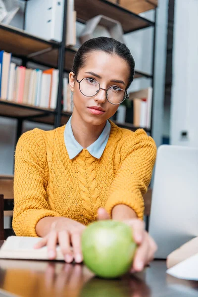 Young Student Girl Preparing Exam Library Holding Green Apple — Free Stock Photo