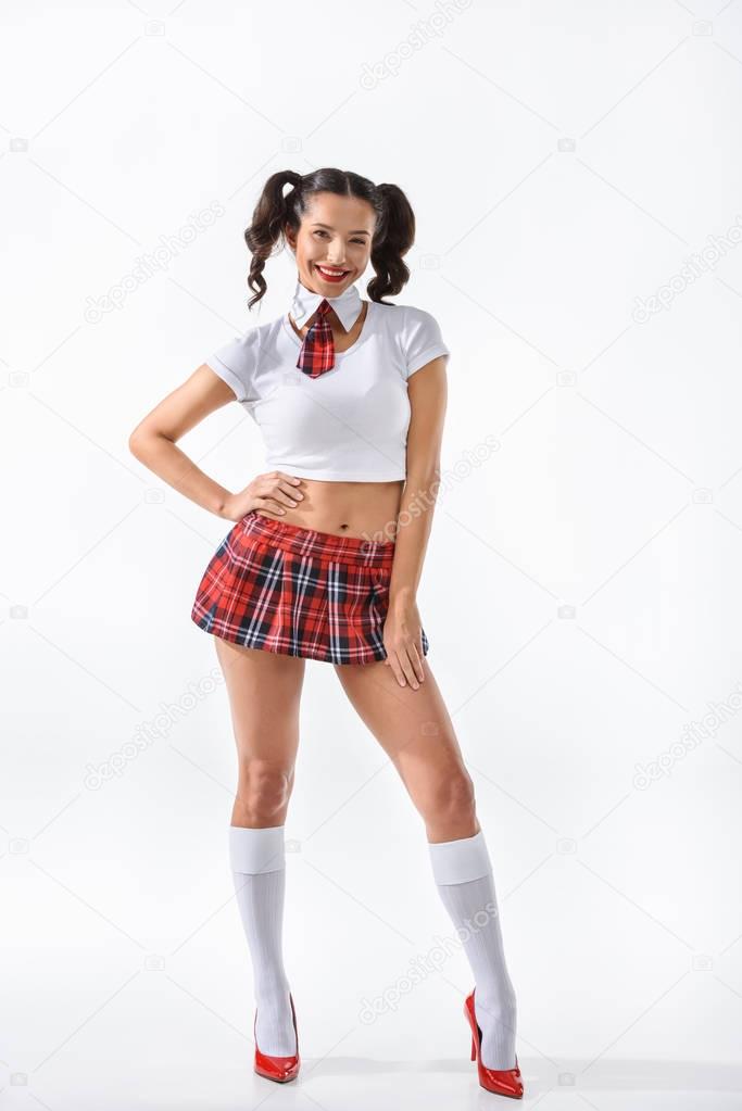 young seductive schoolgirl in short red skirt isolated on white