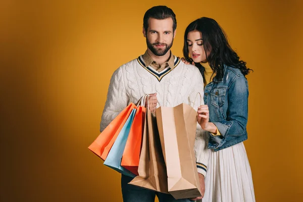 Girlfriend Looking Shopping Bags Isolated Yellow — Stock Photo, Image