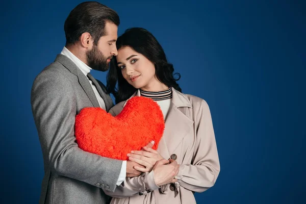 Couple Holding Heart Shaped Pillow Isolated Blue — Stock Photo, Image