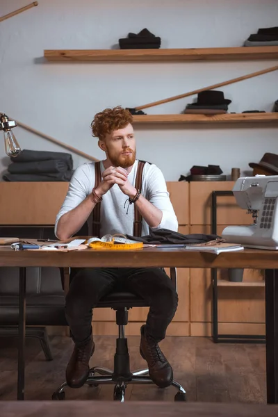 Pensive Young Male Fashion Designer Looking Away While Sitting Workplace — Stock Photo, Image