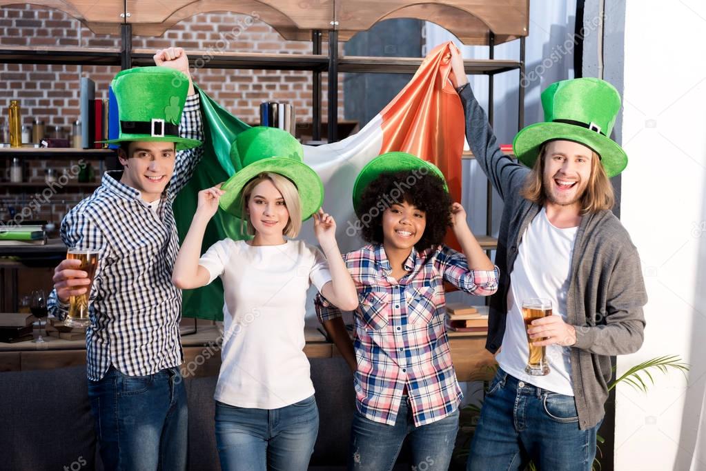 multiethnic friends celebrating saint patrick day at home