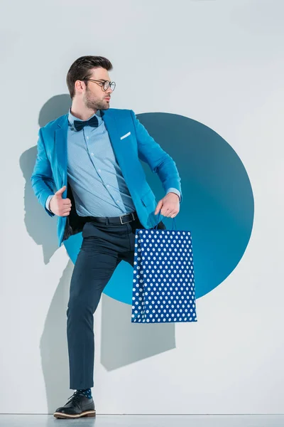 Handsome Stylish Young Man Shopping Bag Looking Away While Stepping — Stock Photo, Image